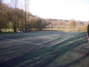 Step 3 of repairing a tennis court, fixing the porous macadam surface