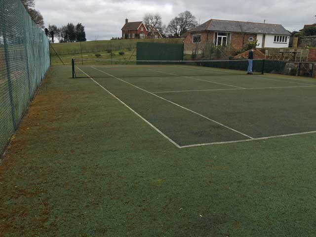 A tennis court in Wadhurst before annual maintenance